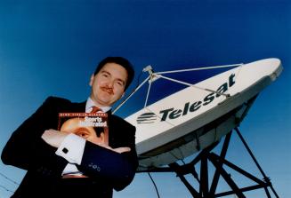 Word War: Sean twomey stands under satellite dish that will receive contents of Sports Illustrated to be printed in Richmond Hill plant.