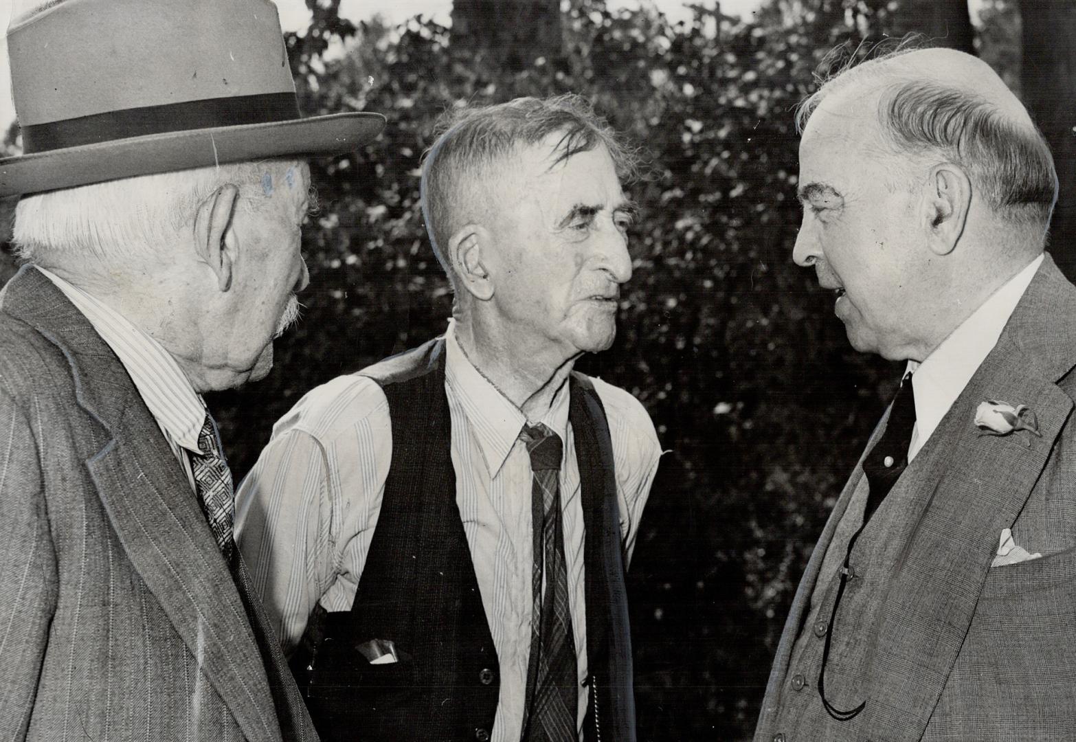 A Tumultuous welcome greeted ex-prime minister during his visit to Waterloo county in 1947. He greets two friends, Dr. T. M. Robinson, 88, and William Winkler, 91. Mr. King's goal was to improve conditions and to bring about well-being of Canadians.
