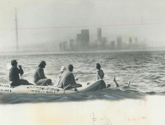 The Toronto skyline was tantalizingly close when 14-year-old Angela Kondrak held a drinking cup and lifted one leg out of the water after a feed break in her unsuccessful attempt to swim Lake Ontario