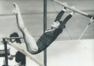 Fading star: Darling of gymnastics world since her dazzling performance at Munich Olympic four years ago, the Soviet Union's Olga Korbut moves on the uneven bars last night