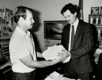 Form letters: Toronto Alderman Chris Korwin-Kuczynski (right) says letters handed him by Bill Mole are form letters and don't count toward a promise he made to pay a share of the $115,000 fine levied against the city after he and 10 other alderman walked out of vote on apartment demolition