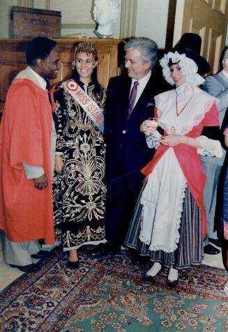Far left to right, Arnim Dolly, mayor of the San Fernando (Trinidad and Tobago) pavilion, Miss Istanbul Ayca Mentes, Caravan president Leon Kossar, and Miss Cardiff (Wales) Brandie Sutton