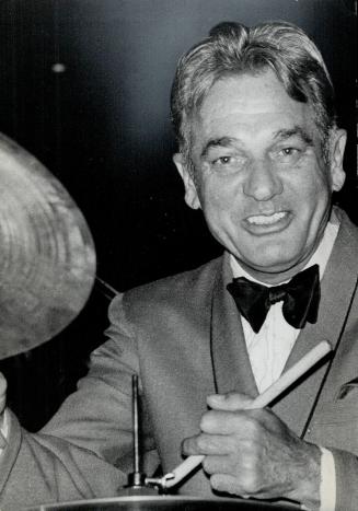 Greying Gene Krupa, 58, unravaged by time. 'He could not swing his way out of a revolving door'