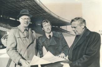 Inspection tour: Baseball commissioner Bowie Kuhn, left, talks over plans for renovating CNE Stadium with Dave Garrick, middle, CNE general manager, and architect Frederic Rounthwaite during visit to Toronto yesterday