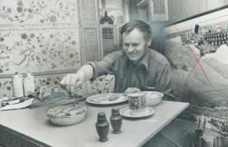 Ukrainian artist William Kurelek enjoys a lunch of cabbage rolls