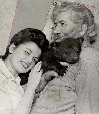 Pretty girls, bear cubs - Joe Laflamme, Ontario's famous wolf hunter, takes them all in his stride since getting into movies in a short about the Canadian wilds
