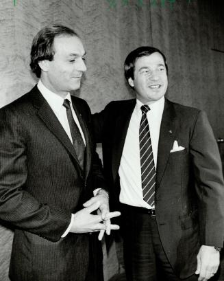 New job for The Flower: Guy Lafleur (left) is welcomed into the Hockey Canada fold by Otto Jelinek, the federal sports minister