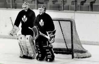 Yeah, that's the ticket: Goaltenders Mark Laforest, left, and Jeff Reese fill the net at yesterday's Leaf practice in what looks like an innovative solution to the team's high goals-against average