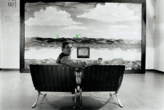 Curator Carmen Lamanna puts himself in the middle of lain Baxter's Landscape.