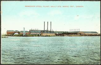 Taken from the river, the image shows a series of more than 8 industrial buildings built right  ...