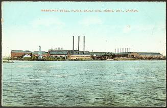 Taken from the river, the image shows a series of more than 8 industrial buildings built right …