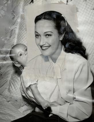 Ten-week-old son of glamourous Dorothy Lamour, John Ridgley Howard poses with his film star mother for this first family portrait