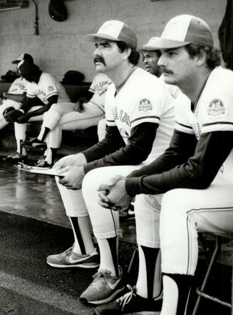 Going to wait: Reliever Dennis Lamp, left, sitting with Jim Clancy, says he will wait until spring training to see what duties the Blue Jays have in mind for him in the 1985 American League season