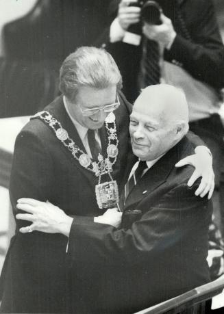 Mayoral embrace: Toronto Mayor Art Eggleton embraces former Toronto mayor Allan A