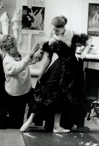 Martine Lamy in fittings for title role in National Ballet's version of Merry Widow. Long dress makes her more aware of upper body, arms and stance.