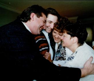 Family Hug: Matt Langen, 19, (second from left) embraces donor Bonnie Naylor. They're flanked by his parents, Jack and Michele.