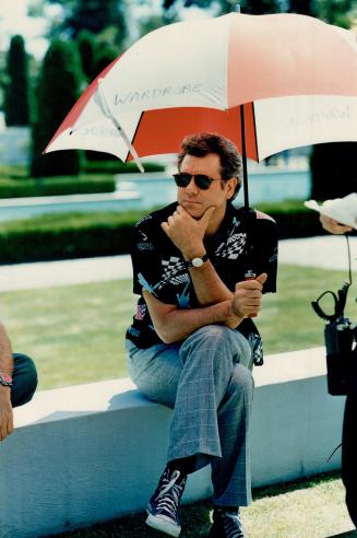 John Larroquette takes a shady break in Oshawa on the set of Hot Paint, a TV comedy movie co-starring Gregory Harrison