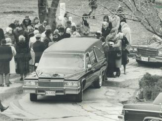 At cemetery: Mourners from Holy Blossom Cemetery in Scarborough flank the hearse that carried the casket of the late Chief Justice Bora Laskin to its final resting place yesterday
