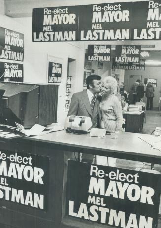 Returned by landslide, North York Mayor Mel Lastman kisses his wife, Marilyn, last night in his poster-decked election headquarters.