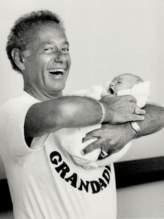 Now it's Grandpa Mel, Mayor Mel Lastman of North York joyfully hoists his new granddaughter, Brie, who weighed in at 7 pounds, 12 ounces