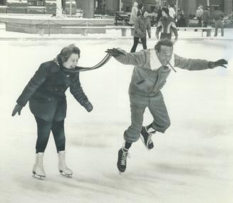 Whoopee! Hitting the ice with enthusiasm, if not grace, are Controller Esther Shiner and North York Mayor Mel Lastman.