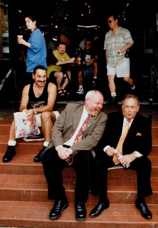 Mayor Mel Lastman enjoys a joke with gay Councillor Kyle Rae on The Steps, a popular hang-out and gathering spot at Church and Wellesley Sts.