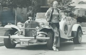 Marilyn Lastman says her $45,000 white and gold Excalibur, a reproduction of the 1933 Mercedes-Benz SSK, makes people happy.