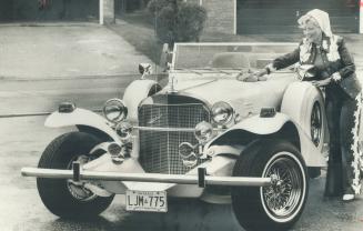 Mrs. Lastman Shines new Bauble: Marilyn Lastman polishes up her new white-and-gold Excalibur, a $34,900 hand-built reproduction of a 1933 Mercedes SSK sports car, at her home yesterday.
