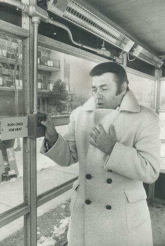 Heat's on at bus stop: Controller Mel Lastman, North York mayoralty candidate, presses the button to turn on heating unit in first of four bus shelters in the borough to be heated
