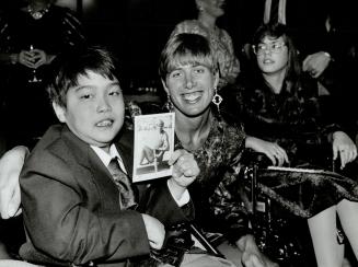 Winning smiles: Harold Chae, 11, the 1992 Easter Seals Timmy, meets Silken Laumann, Canada's athlete of the year and Lou Marsh award winner, at the Conn Smythe Sports Celebrities Dinner last night