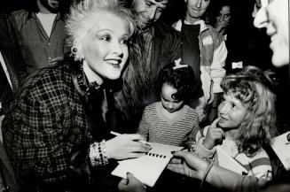 Would mom do my hair like that?, Rock's dazzling Cyndi Lauper thrilled young fans during an afternoon autograph session in the Westbury Hotel before her concert last night at Maple Leaf Gardens