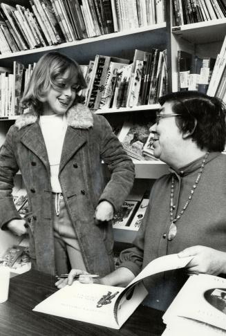 Eleven-year-old: Shelagh O'Conner looks on as author Margaret Laurence autographs a book at Children's Book Store.