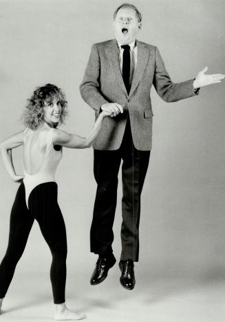 He ain't heavy: Gary Lautens gets a lift from Jaci Daly, who makes the hottest dancewear and aerobic wear in Canada, as well as the fetching number in the movie Crocodile Dundee