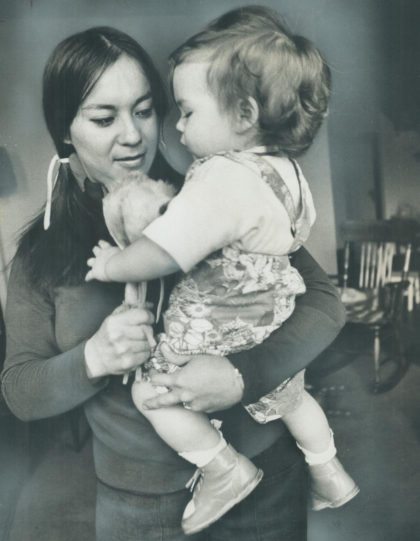 Mrs. Jeanette Lavell, 28, an Ojibway Indian, seen with son, won a victory for other Indian women who have married white men. She won decision against Indian Act which says a woman marrying a non-Indian loses her status with her band. She based her case on the Bill of Rights.