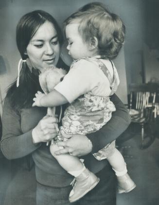 Mrs. Jeanette Lavell, 28, an Ojibway Indian, seen with son, won a victory for other Indian women who have married white men. She won decision against Indian Act which says a woman marrying a non-Indian loses her status with her band. She based her case on the Bill of Rights.