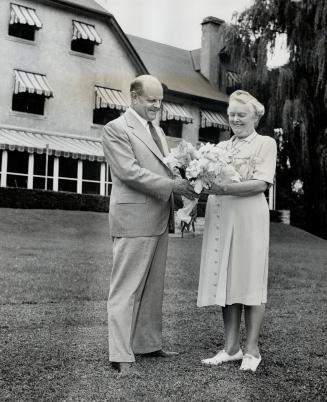 Mr. and Mrs. Lawson on the lawn in front of their home. The party was the first ever held at the private home of a Lieutenant-Governor, and biggest of its kind since closing of Chorley Park.