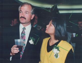 Mixed feelings: Mayoral candidate Jack Layton and wife Olivia Chow look glumly at results showing him trailing June Rowland