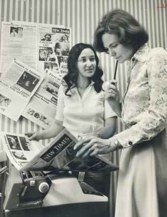 Editor-Nun Mary Jo Leddy, right looks over an edition of the Catholic New Times with Christine Belza, the only paid worker on the controversial new Toronto tabloid church newspaper