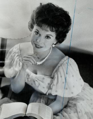 Meet the preacher, Georgia Lee, a minister's wife and movie star who appeared in five Billy Graham movies, will sing and preach at CNE bandshell evanglistic meet Saturday