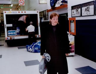 Gary Leeman leaves Toronto Maple Leaf dressing room yesterday for last time after being traded to the Calgary Flames as part of the biggest player swap in NHL history