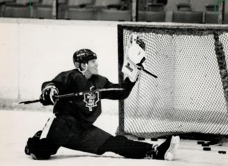 Ailing right winger Gary Leeman slips on a goalie's glove and fields a few pucks in the same 90-minute workout