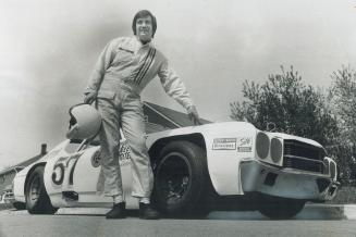 Norm Lelliott stands in front of an experimental racing machine which he hopes will knock over the opposition in this season's stock car races