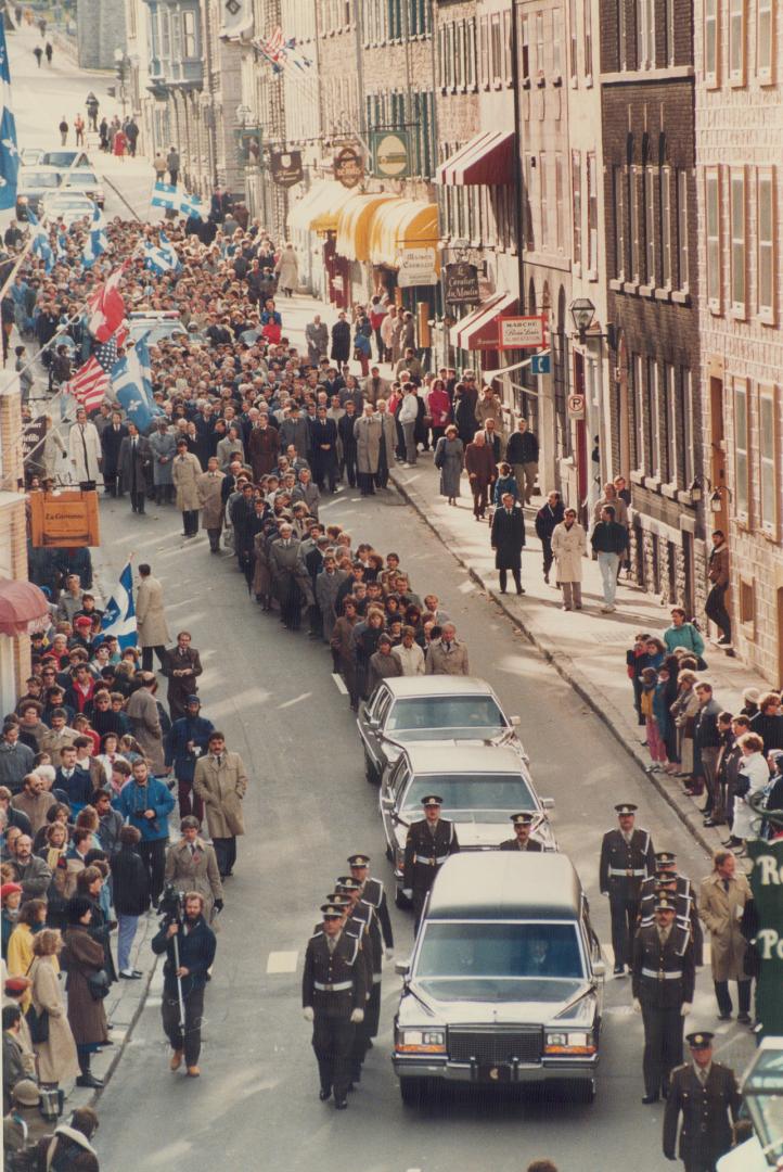 Funeral cortege: Crowds line the old city as Quebec police lead the hearse carrying former premier Rene Levesque from Quebec's National Assembly to a funeral service in Quebec city's Basilica