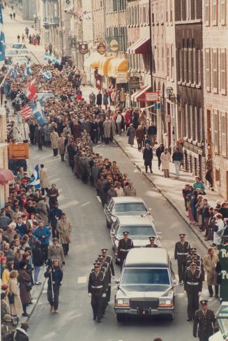 Funeral cortege: Crowds line the old city as Quebec police lead the hearse carrying former premier Rene Levesque from Quebec's National Assembly to a funeral service in Quebec city's Basilica