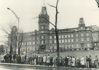 Final goodbye: Long lines formed yesterday outside the Quebec National Assembly where the body of former premier Rene Levesque lay in state after being flown to Quebec city from Montreal