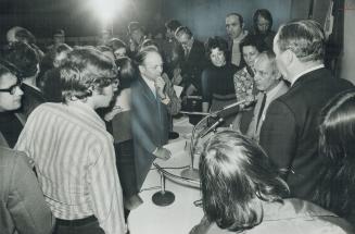 Parti Quebecois Leader Rene Levesque (at microphone), surrounded by questioners during a break at a recent weekend conference at Toronto's Holy Blossom Temple, was received with some apprehension by his audience, but Jewish traditions of liberalism and hospitality prevailed and there was no confrontation, writes Erna Paris