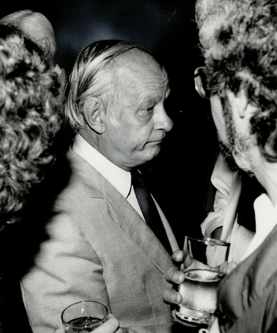 Collared: Quebec Premier Rene Levesque reacted quickly when he felt a hand on his collar during a reception during the premiers' conference in Toronto last night