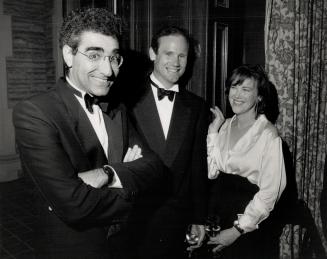 Comedy kings: Actor Eugene Levy (left) hams for the camera with actress Catherine O'Hara (right), who was accompanied by her beau, Bo Welch, at post-performance Phantom party in Casa Loma last night