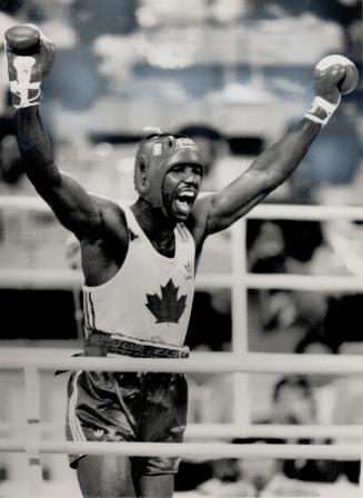 Golden moment: Kitchener's own Lennox Lewis had a mile-wide smile as he saluted his gold medal win at Olympics