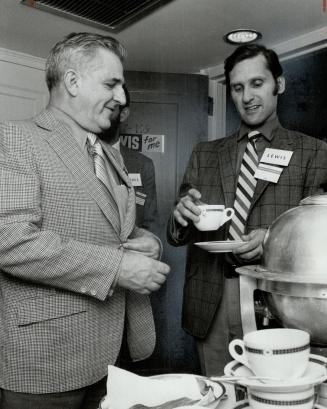Pouring coffee in his room at Royal York Hotel for visiting delegates who droppd in, Stephen Lewis, provincial NDP leadership candidate, hands a cup to one firm supporter, his father David Lewis, deputy leader of the federal NDP